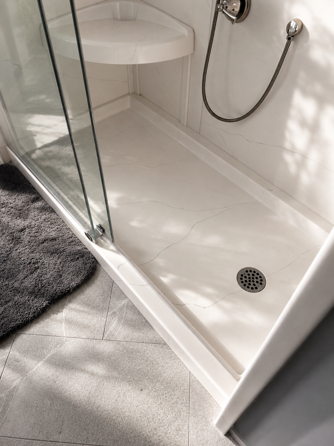 Custom shower base with matching wall panels